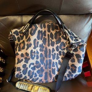 Beautiful leopard bag with unique shoulder strap.
